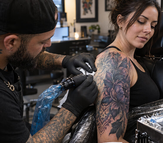 Can a cover-up tattoo completely hide a name or an old portrait