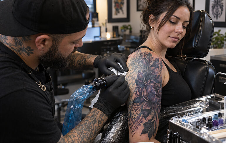 Can a cover-up tattoo completely hide a name or an old portrait